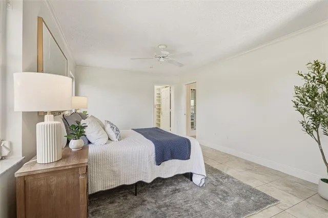an aerial view of ocean and residential houses with outdoor space