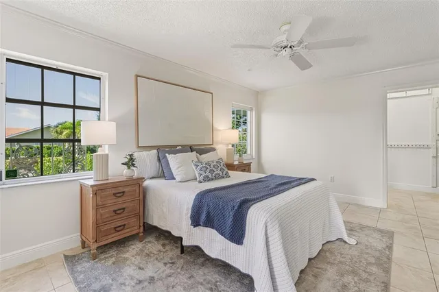 an aerial view of a house a yard swimming pool outdoor seating and entertaining space