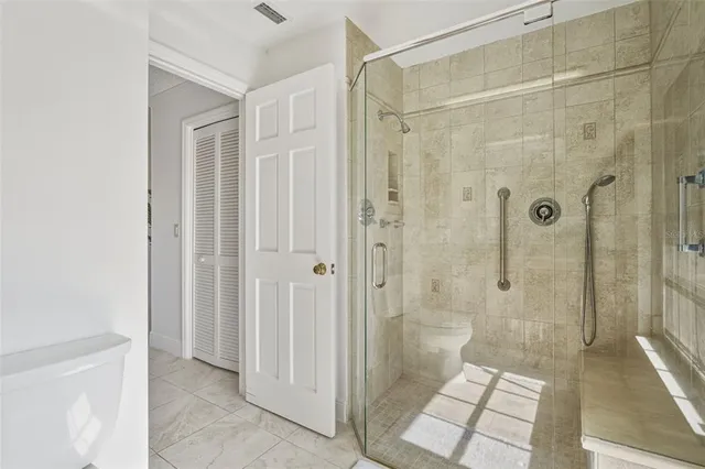 a large kitchen with cabinets and stainless steel appliances