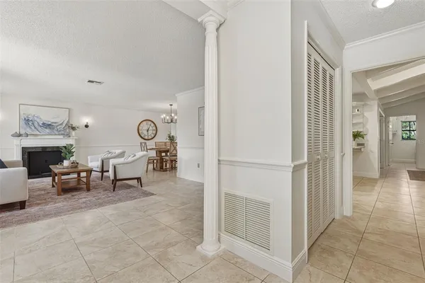 a living room with fireplace furniture and a window