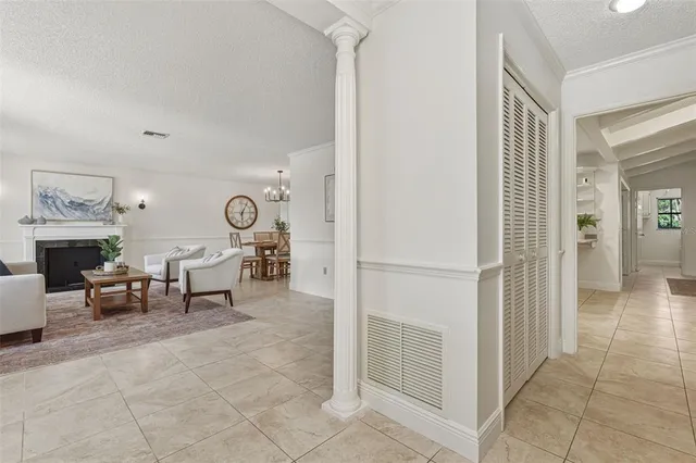 a living room with fireplace furniture and a window