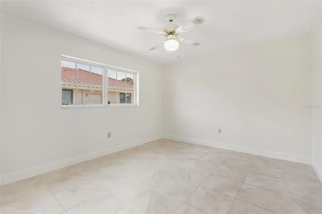 a room with gym equipment and a large window