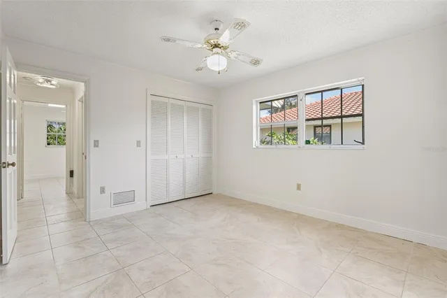 a view of a livingroom with furniture and a window