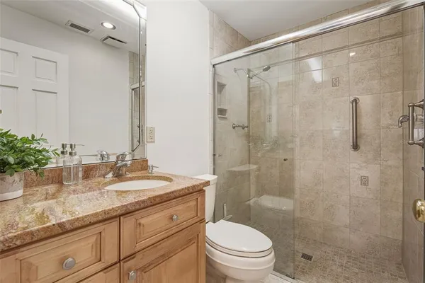 a view of a house with swimming pool lawn chairs and a yard