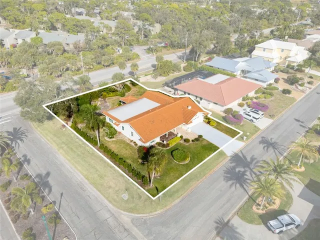 an aerial view of residential houses with city view