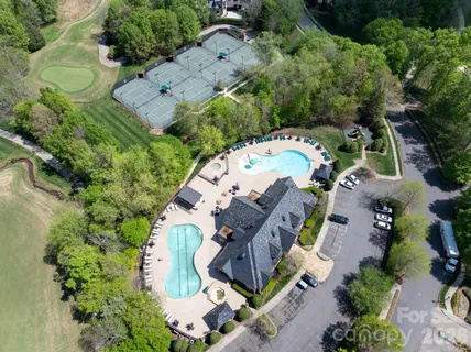an aerial view of house with a yard