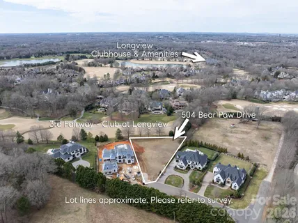 an aerial view of a house with outdoor space