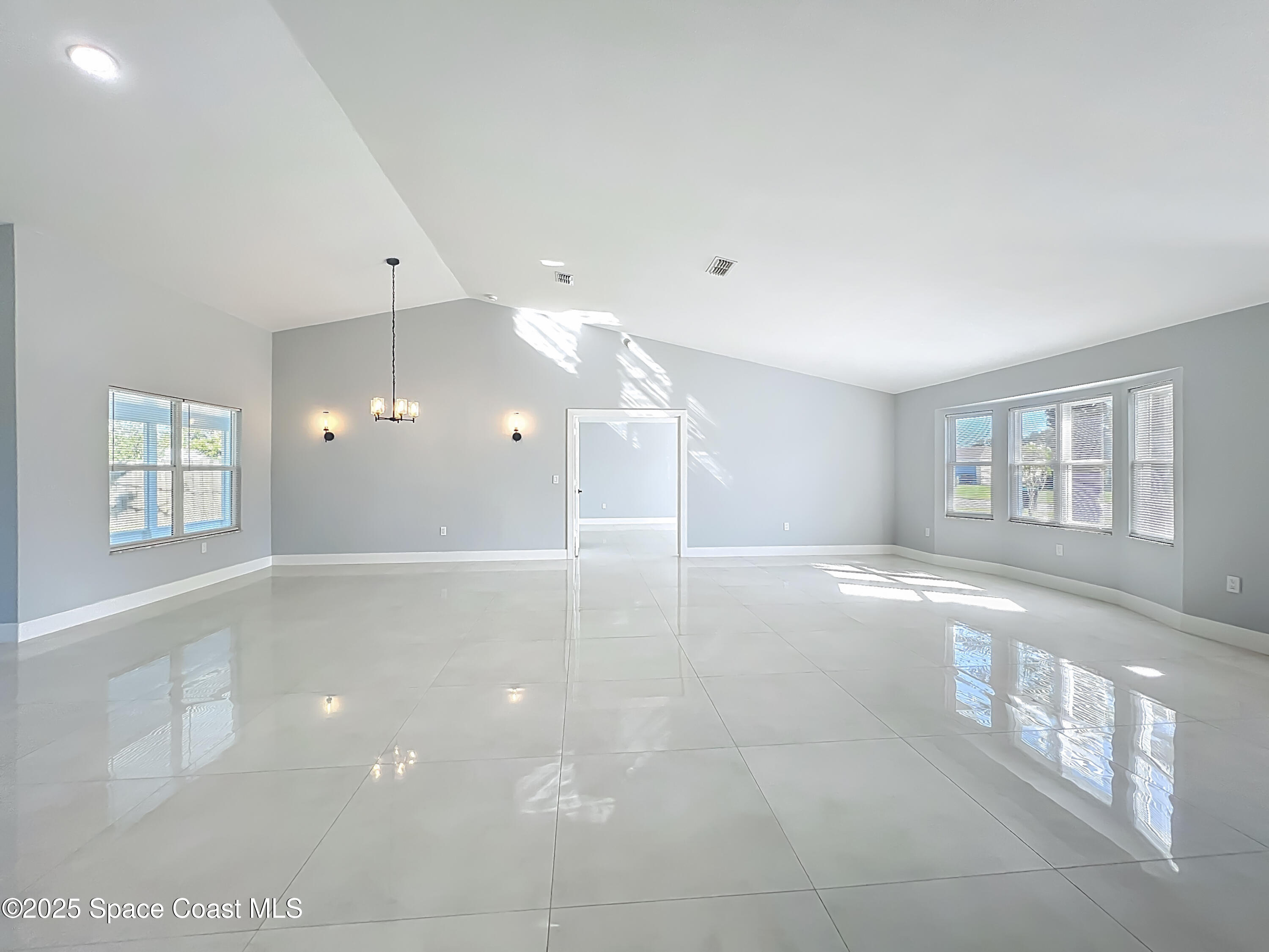 1911 Academy Street Northeast Palm Bay, FL 32905 - Photo 3 of 65 a view of an empty room with a window