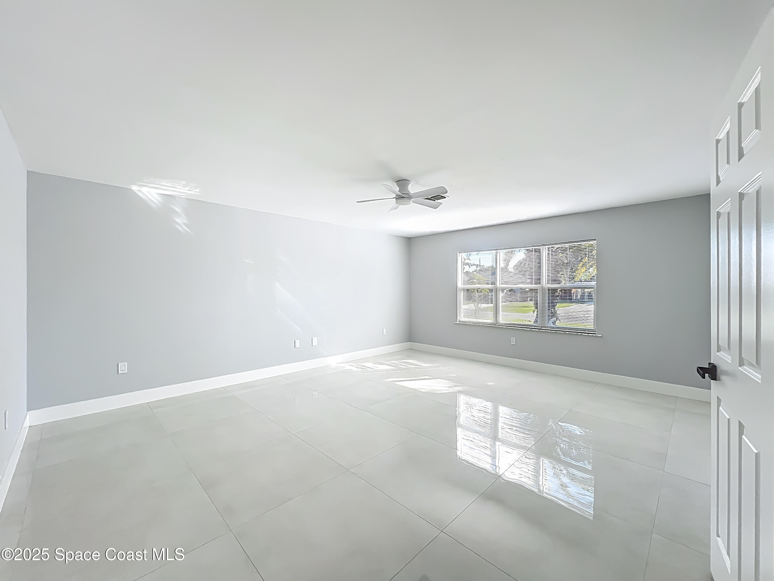 1911 Academy Street Northeast Palm Bay, FL 32905 - Photo 36 of 65 a view of an empty room with a window