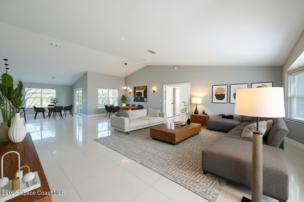 1911 Academy Street Northeast Palm Bay, FL 32905 - Photo 4 of 65 a living room with furniture and a wooden floor