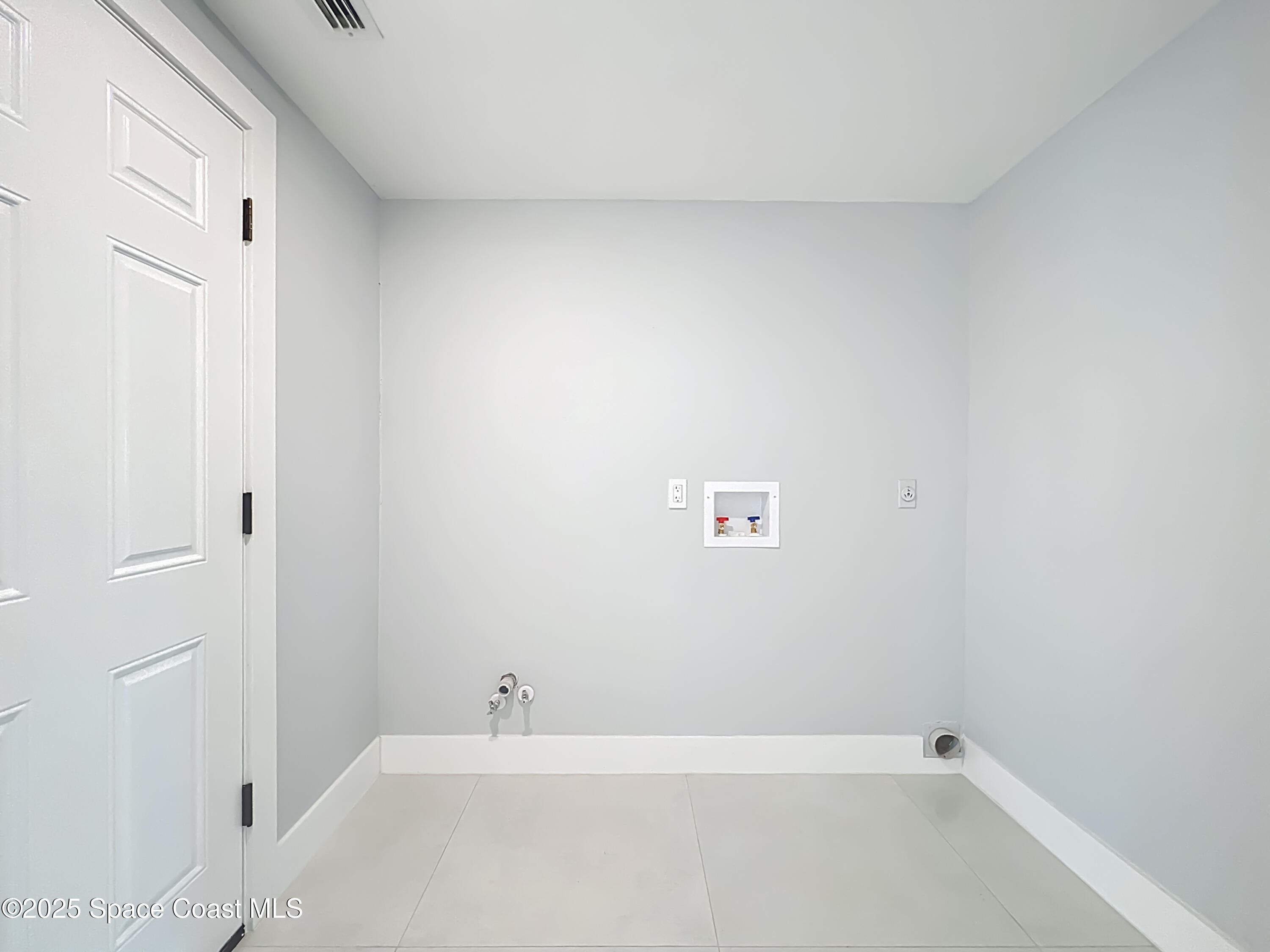 1911 Academy Street Northeast Palm Bay, FL 32905 - Photo 48 of 65 a bathroom with a bathtub