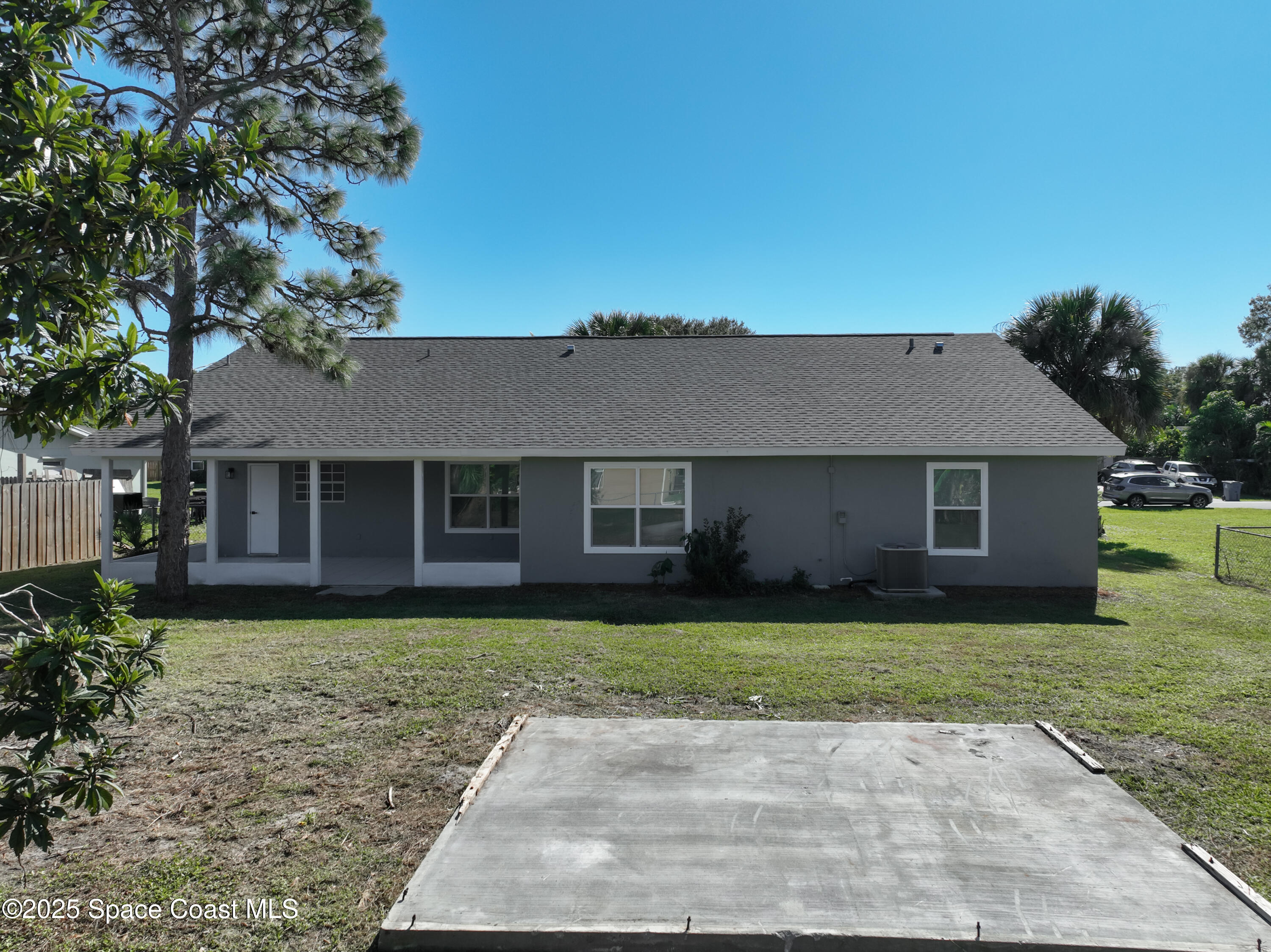 1911 Academy Street Northeast Palm Bay, FL 32905 - Photo 54 of 65 a view of a yard in front of a house