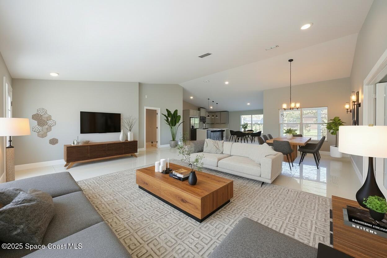 1911 Academy Street Northeast Palm Bay, FL 32905 - Photo 6 of 65 a living room with furniture and a flat screen tv