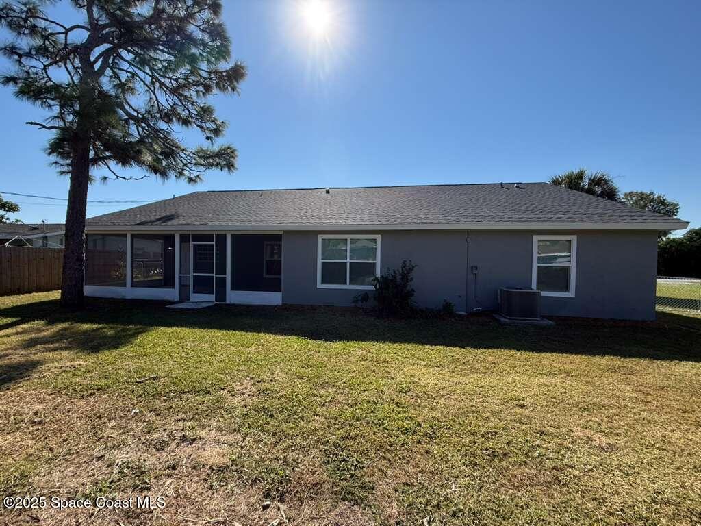 1911 Academy Street Northeast Palm Bay, FL 32905 - Photo 64 of 65 a house view with a garden space