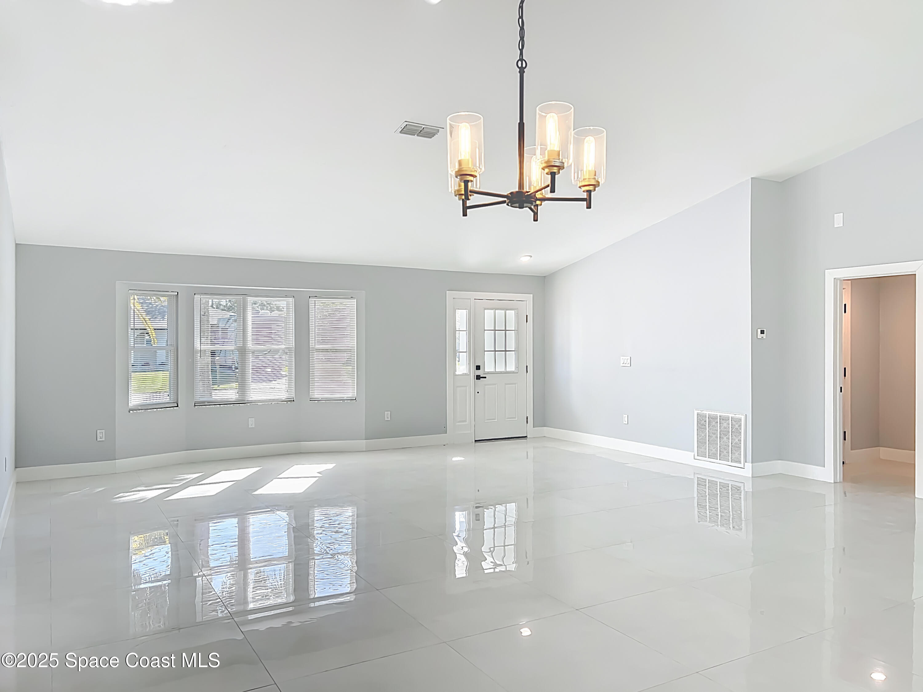 1911 Academy Street Northeast Palm Bay, FL 32905 - Photo 8 of 65 a view of an empty room with a window