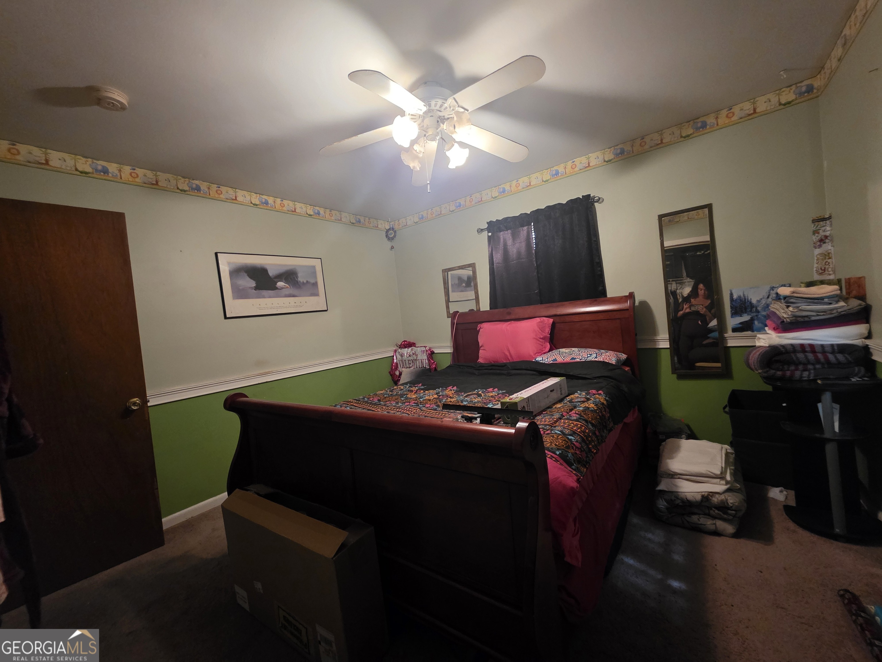 115 Burnside Street Jonesboro, GA 30236 - Photo 12 of 19 a living room with furniture and a flat screen tv