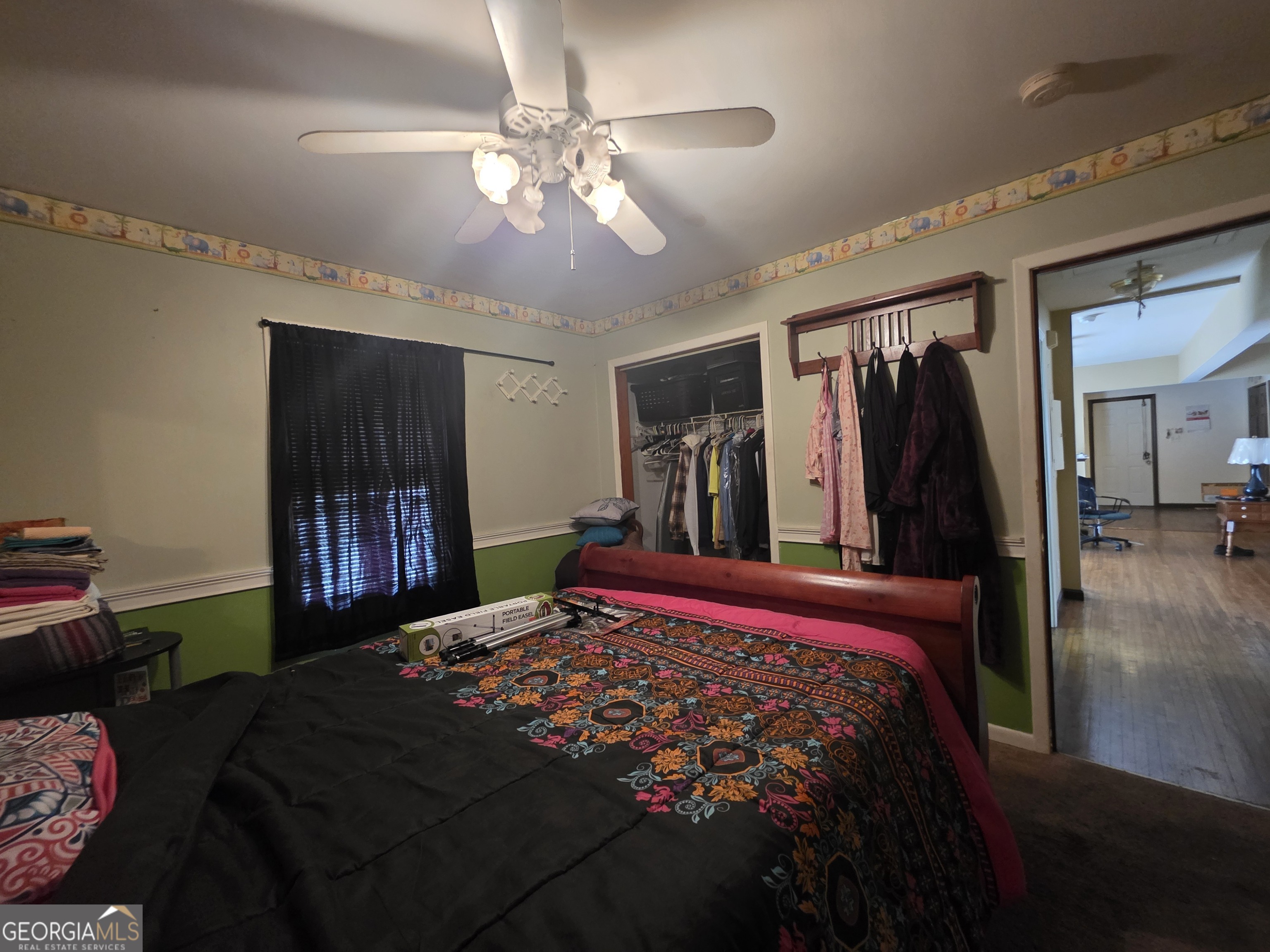 115 Burnside Street Jonesboro, GA 30236 - Photo 13 of 19 a bed room with a bed and a television