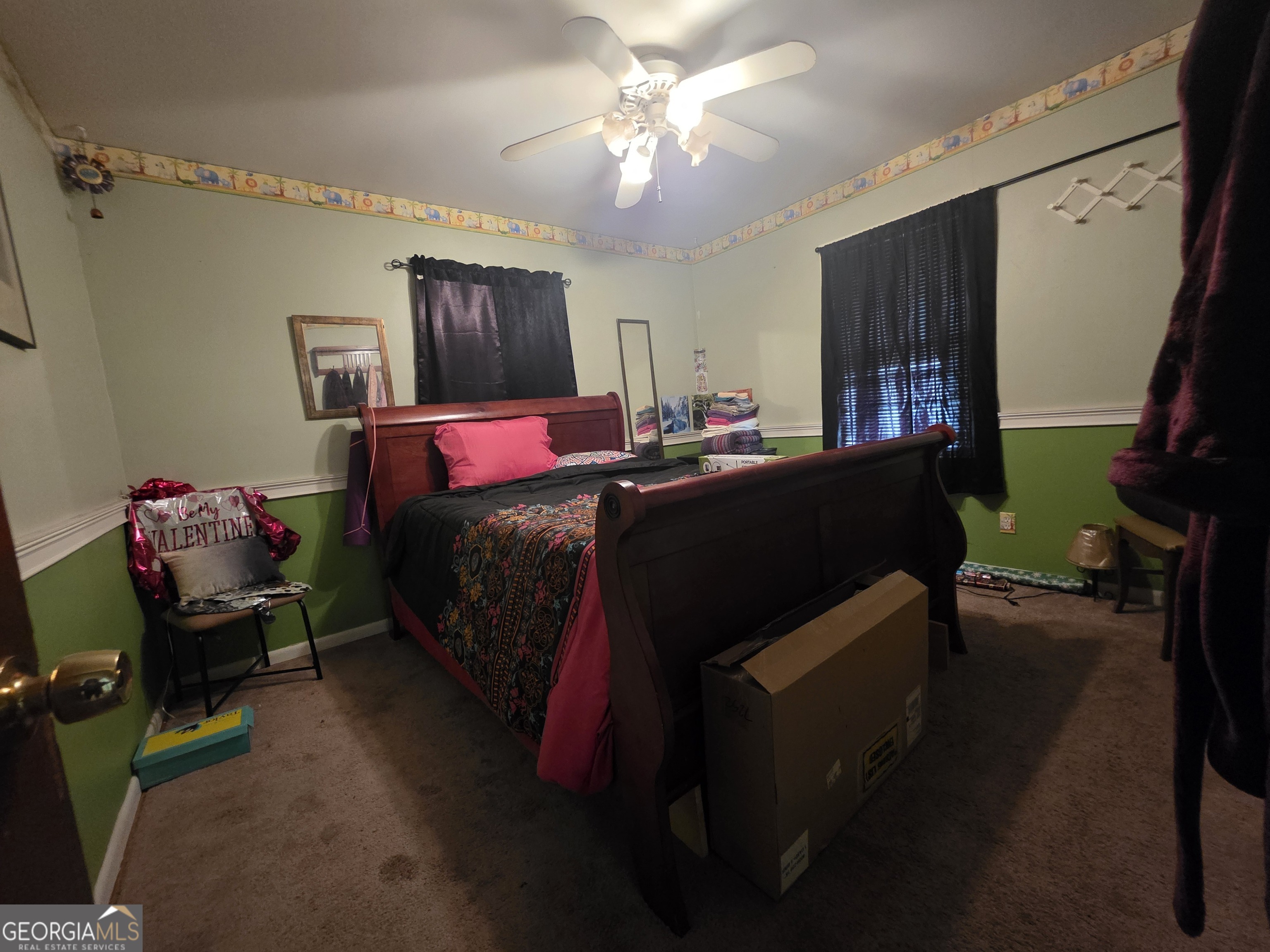 115 Burnside Street Jonesboro, GA 30236 - Photo 14 of 19 a bed room with a bed window and a chair