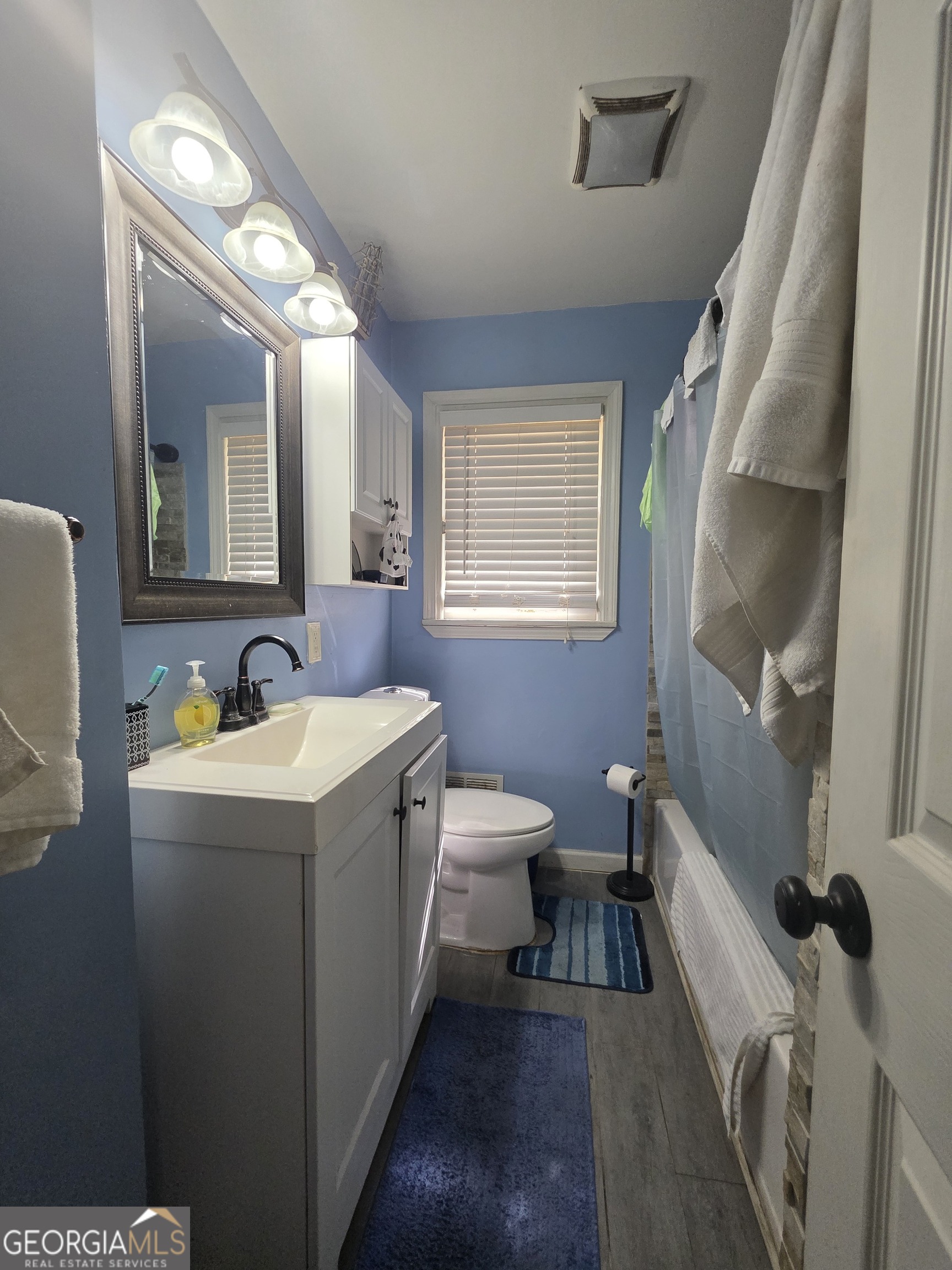 115 Burnside Street Jonesboro, GA 30236 - Photo 15 of 19 a view of a bathroom with tub and sink