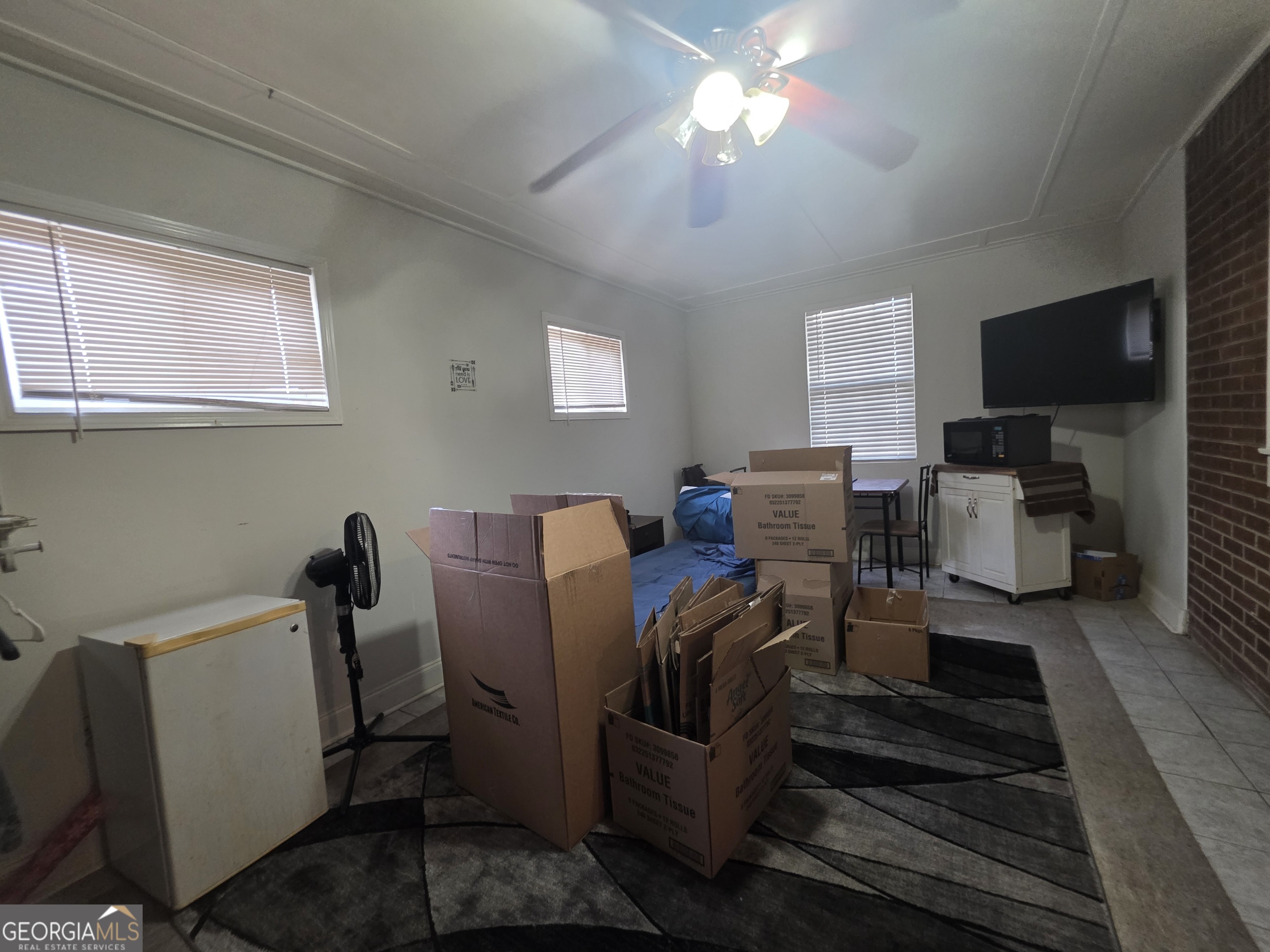 115 Burnside Street Jonesboro, GA 30236 - Photo 16 of 19 a view of a livingroom with furniture and a flat screen tv