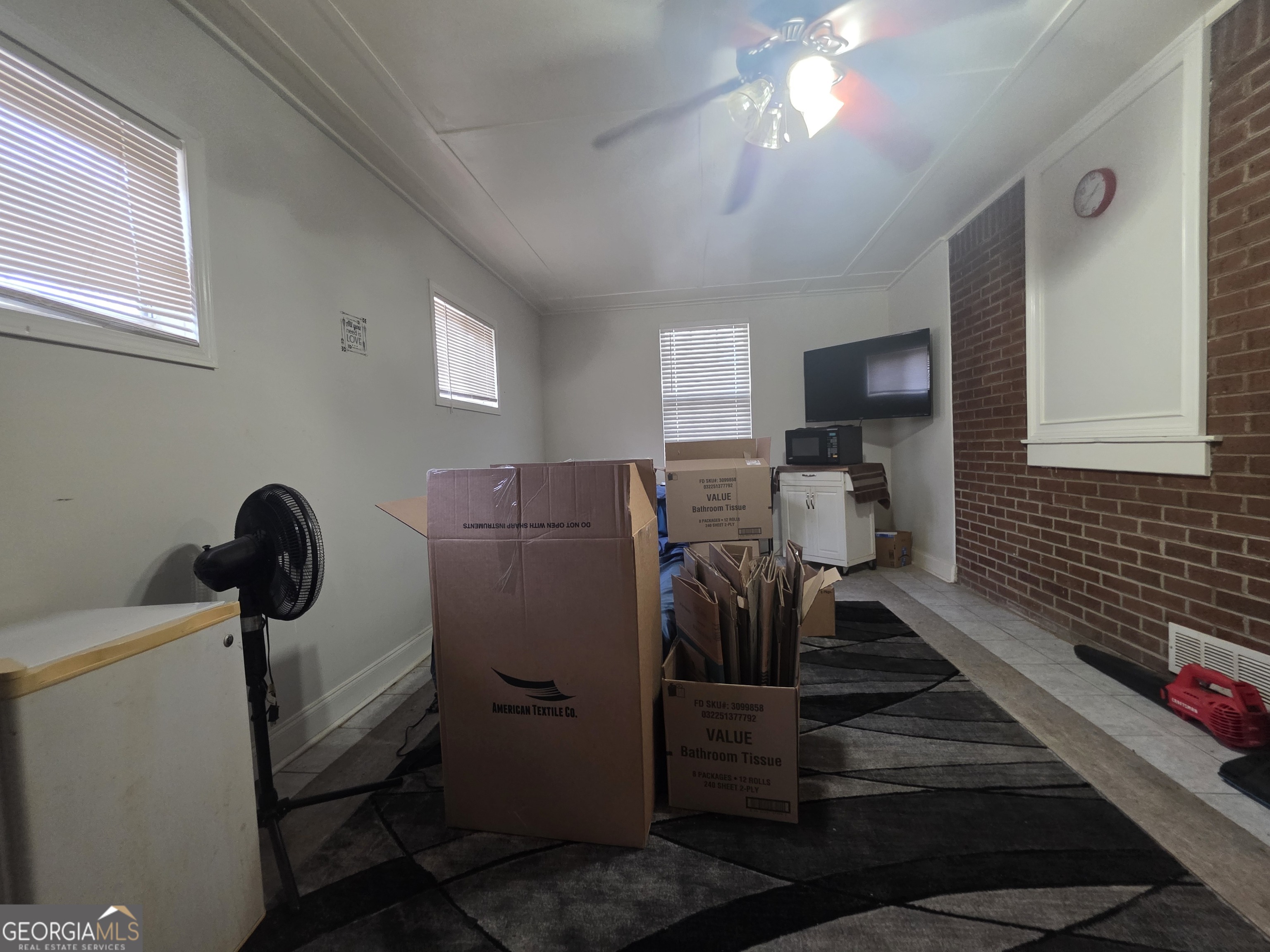 115 Burnside Street Jonesboro, GA 30236 - Photo 18 of 19 a living room with furniture and a window
