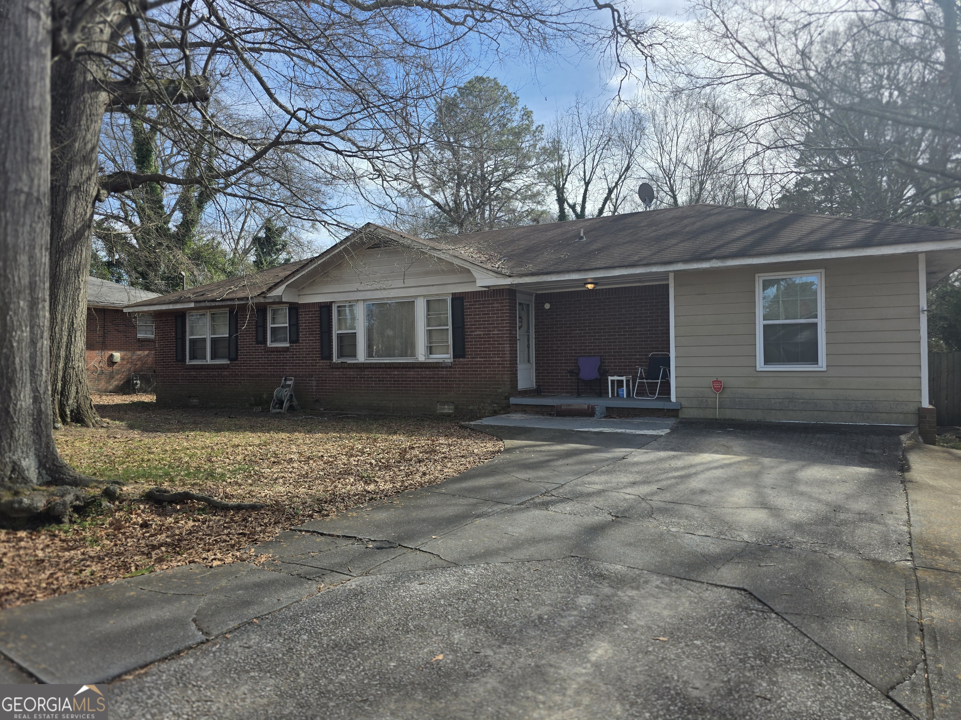 115 Burnside Street Jonesboro, GA 30236 - Photo 2 of 19 a front view of a house with a yard and garage