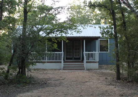 a front view of a house with a fence