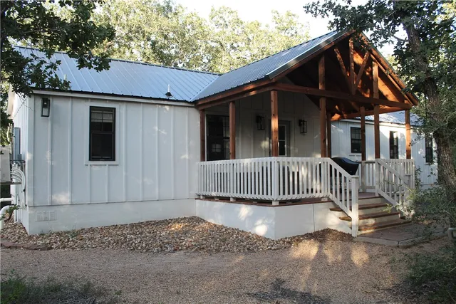 a view of living room with furniture and wooden floor
