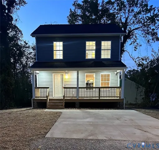 a view of a brick house with a large windows