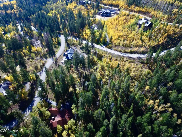 an aerial view of house with yard