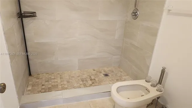 a view of a hallway with wooden shelves