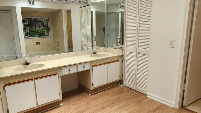 a view of a room with wooden floor