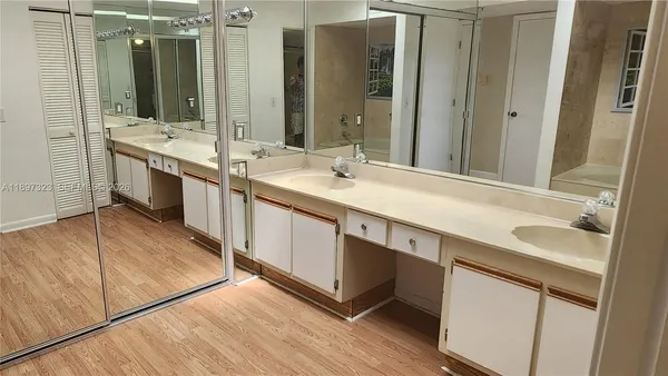 a view of a room with wooden floor