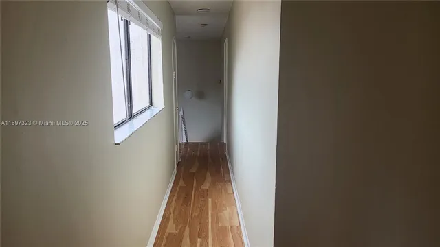 a view of a bathroom with a glass door and a shower