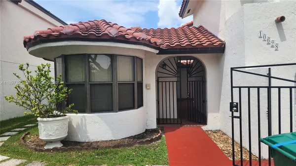 a view of a livingroom with an empty space and a window