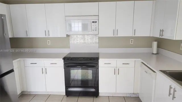 an empty room with wooden floor and sliding door