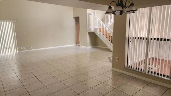 a view of a garage with stairs