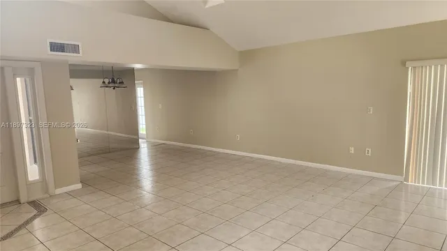 a view of an empty room with empty room