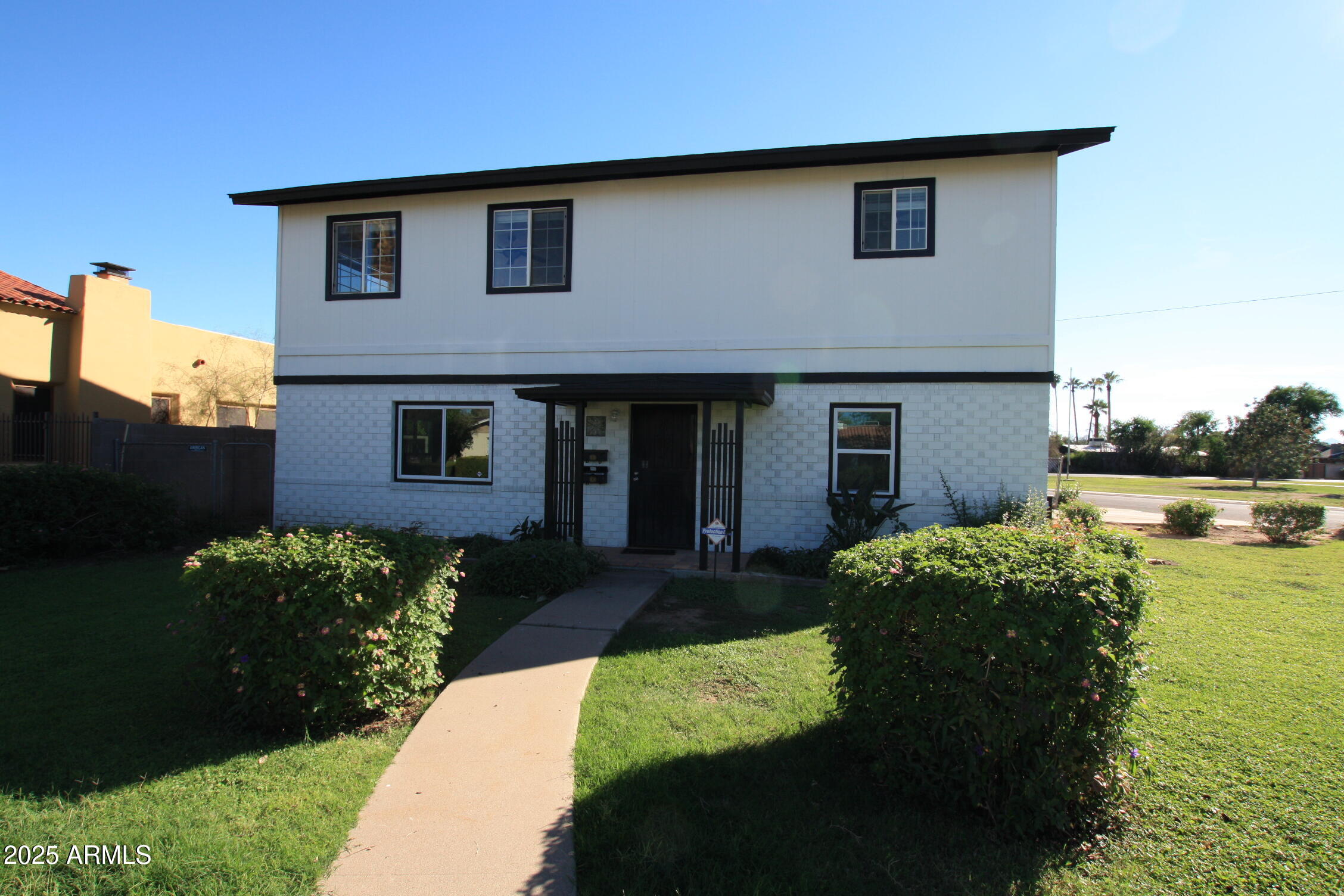 a house view with a garden space