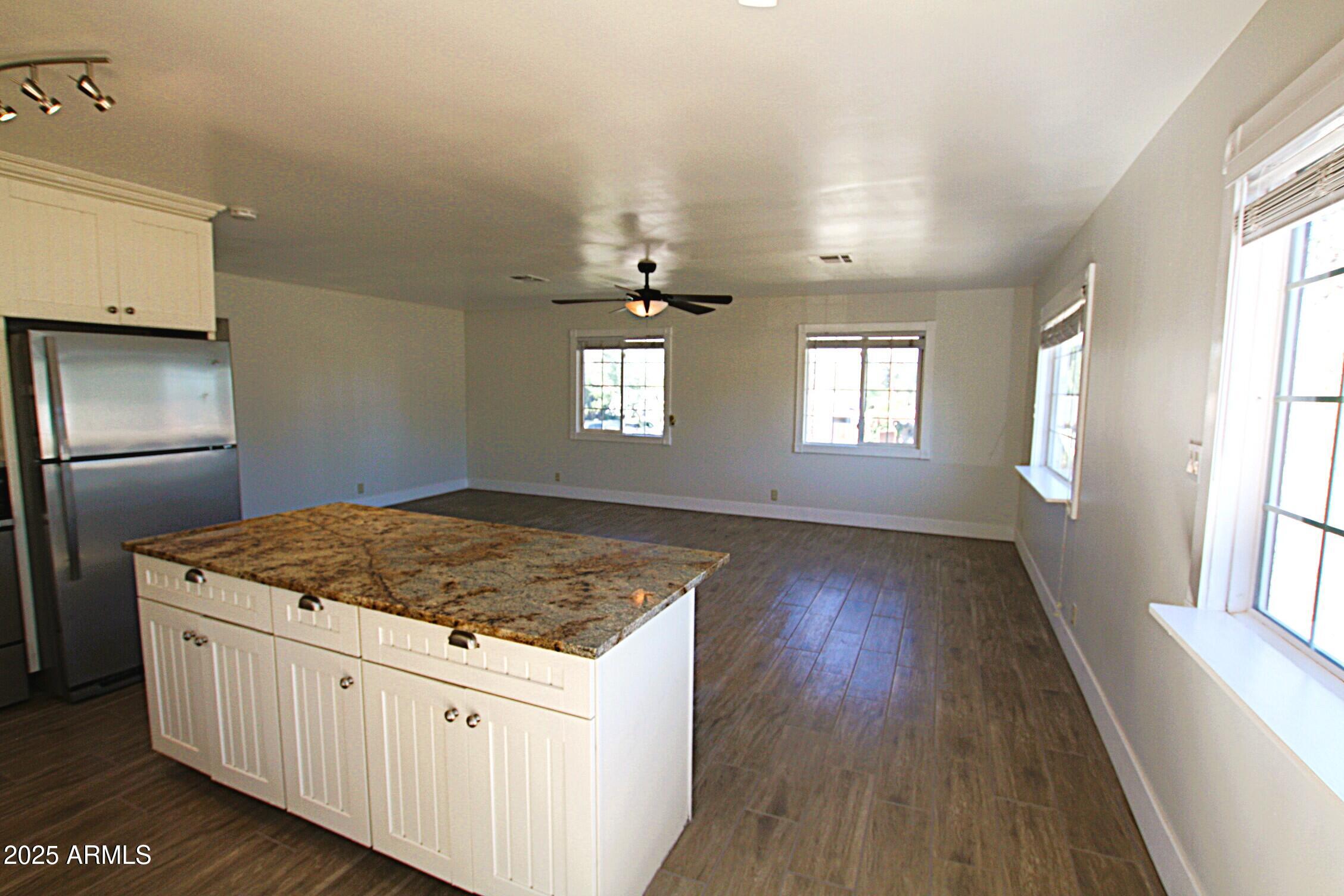 1333 East Flower Street, Unit REAR Phoenix, AZ 85014 - Photo 12 of 34 a kitchen with a hardwood floor and window