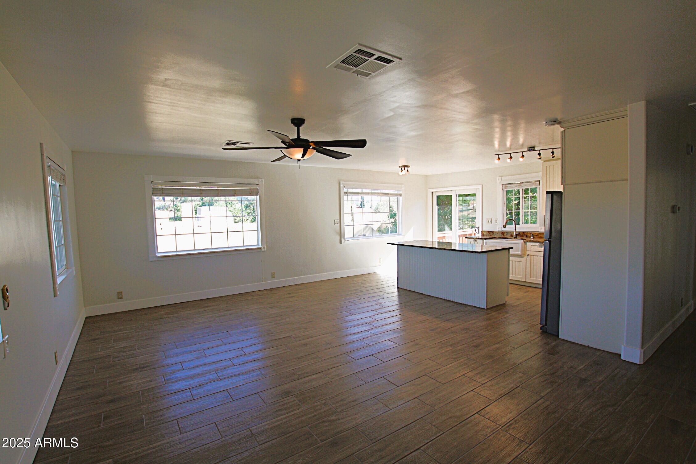 1333 East Flower Street, Unit REAR Phoenix, AZ 85014 - Photo 15 of 34 a view of a kitchen and an empty room