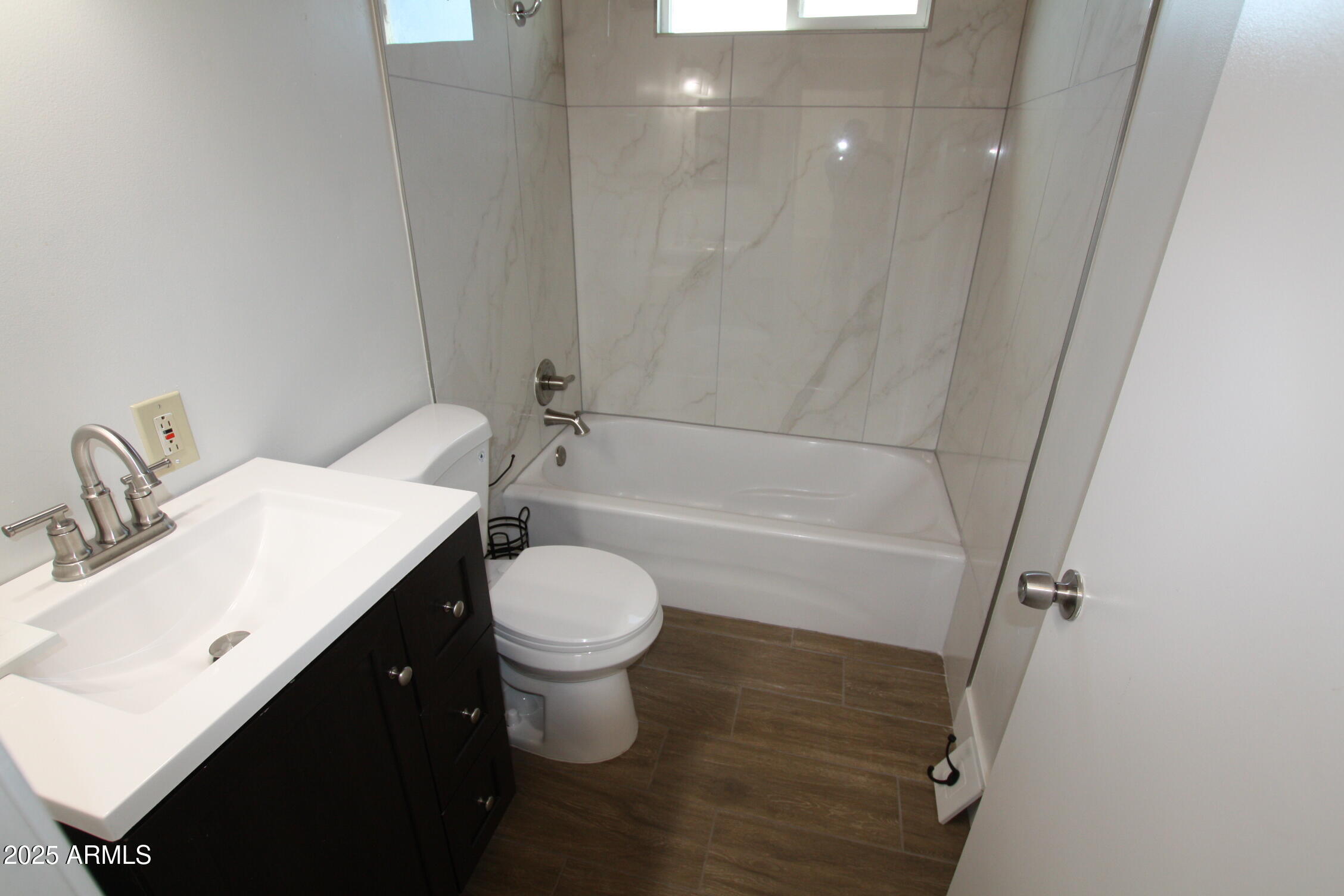 1333 East Flower Street, Unit REAR Phoenix, AZ 85014 - Photo 19 of 34 a bathroom with a sink toilet and shower