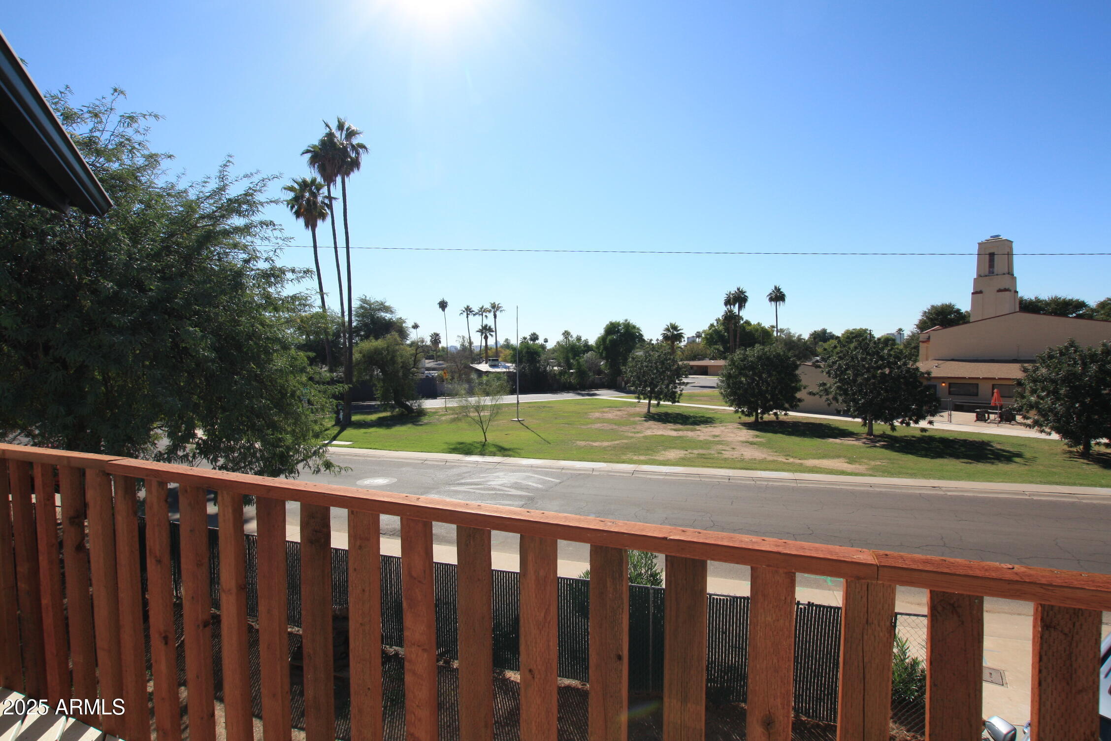 1333 East Flower Street, Unit REAR Phoenix, AZ 85014 - Photo 29 of 34 a view of a street with a yard and a fence