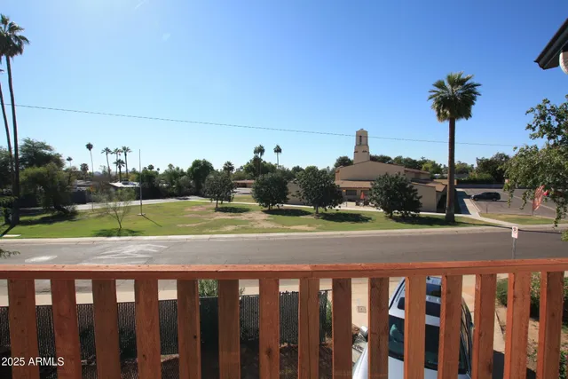 a view of a street in front of a house