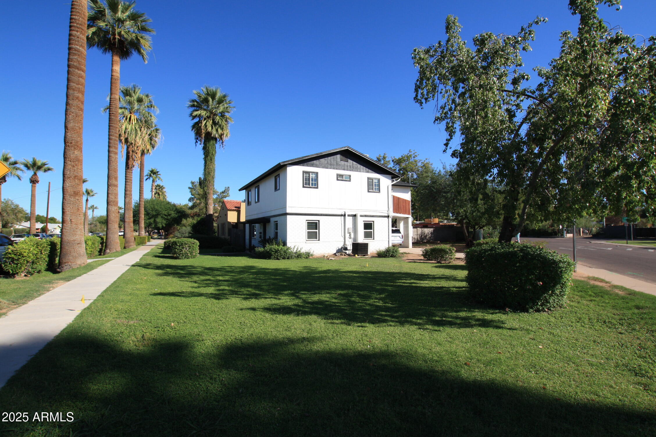 1333 East Flower Street, Unit REAR Phoenix, AZ 85014 - Photo 3 of 34 a front view of a house with a garden