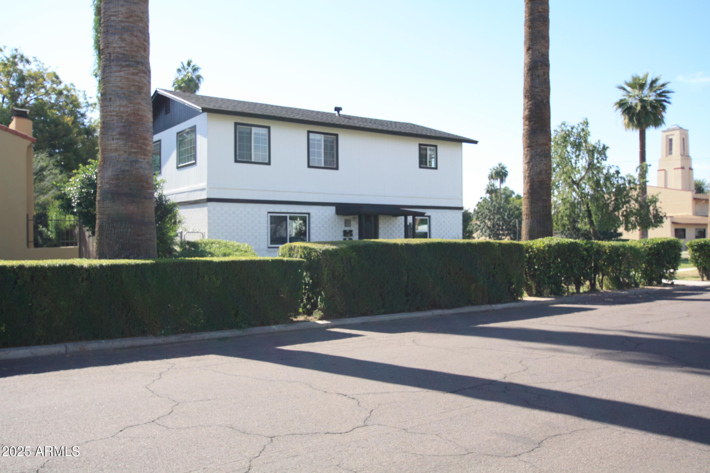 1333 East Flower Street, Unit REAR Phoenix, AZ 85014 - Photo 4 of 34 a front view of a house with a yard