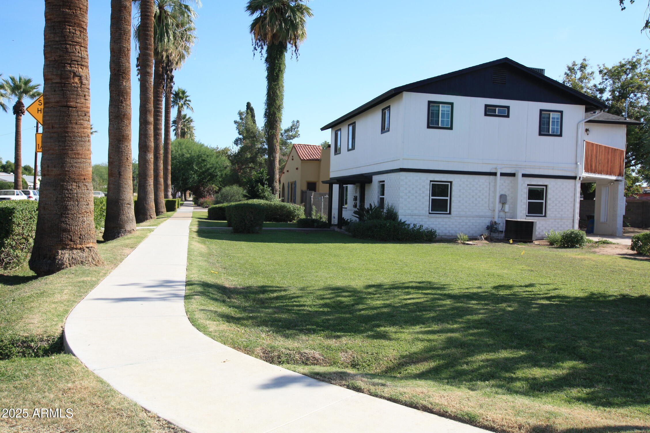 1333 East Flower Street, Unit REAR Phoenix, AZ 85014 - Photo 5 of 34 a front view of a house with a yard