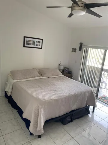 a bedroom with a bed and wall painting