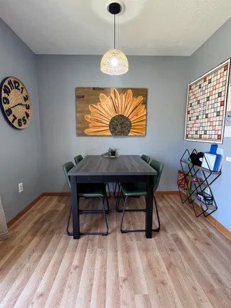 a workspace with furniture window and wooden floor