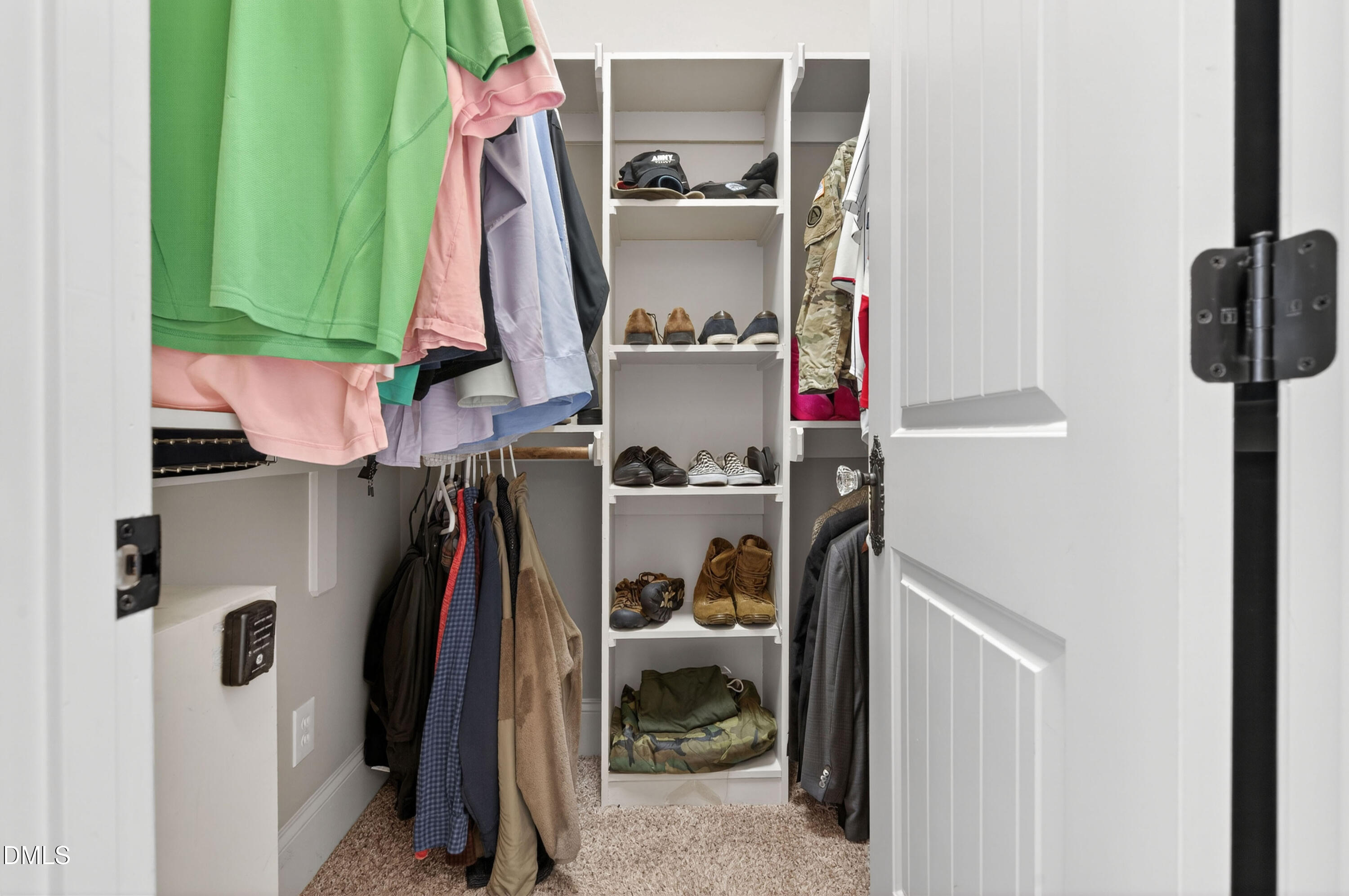 691 Hawthorne Place Creedmoor, NC 27522 - Photo 34 of 84 a view of walk in closet with clothes and shoes